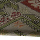 Handwoven Woollen Dhurrie with Geometric Tribal Pattern – Green & Terracotta
