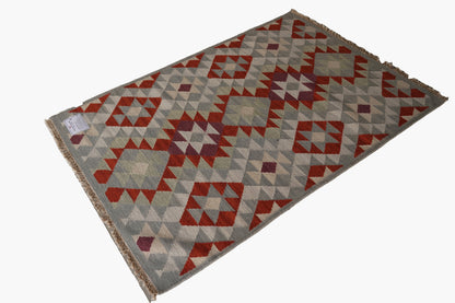 Handwoven Woollen Dhurrie with Geometric Tribal Pattern – Multicolor
