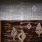 Elegant Geometric Pattern Machine-Made Rug in Rich Brown Tones